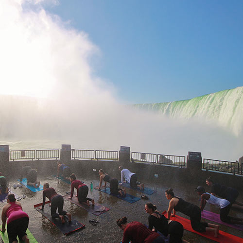 Yoga poses in front of the falls