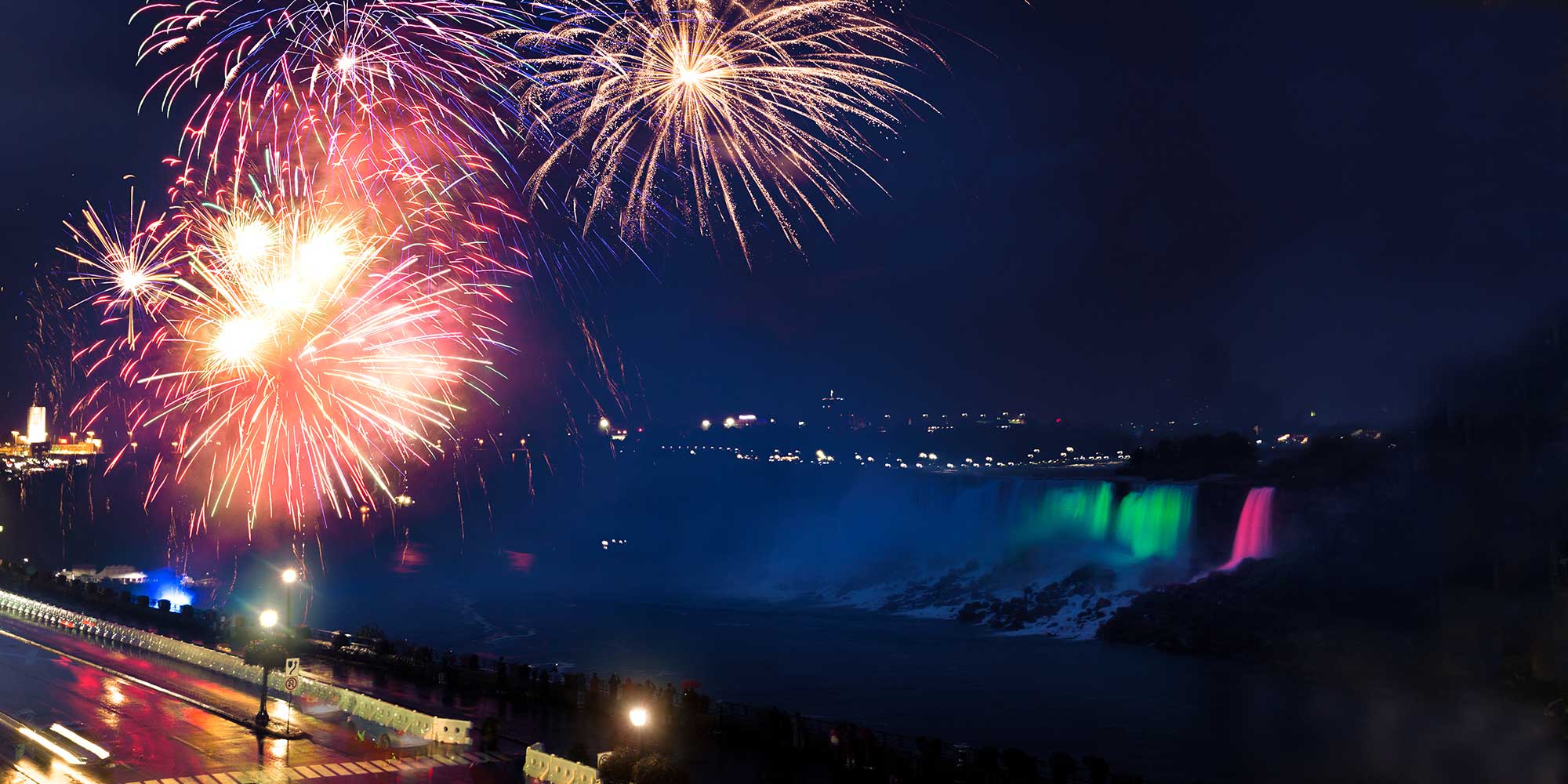 A falls fireworks background image with a 'Holiday' logo on top