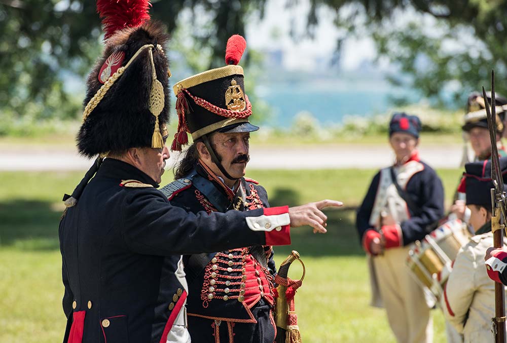 A soldier directing another soldier for the War of 1812