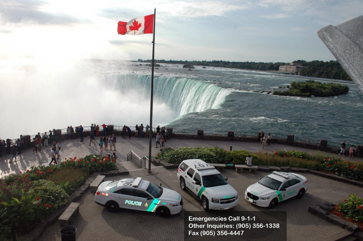 Police cruisers surrounding the top of the falls