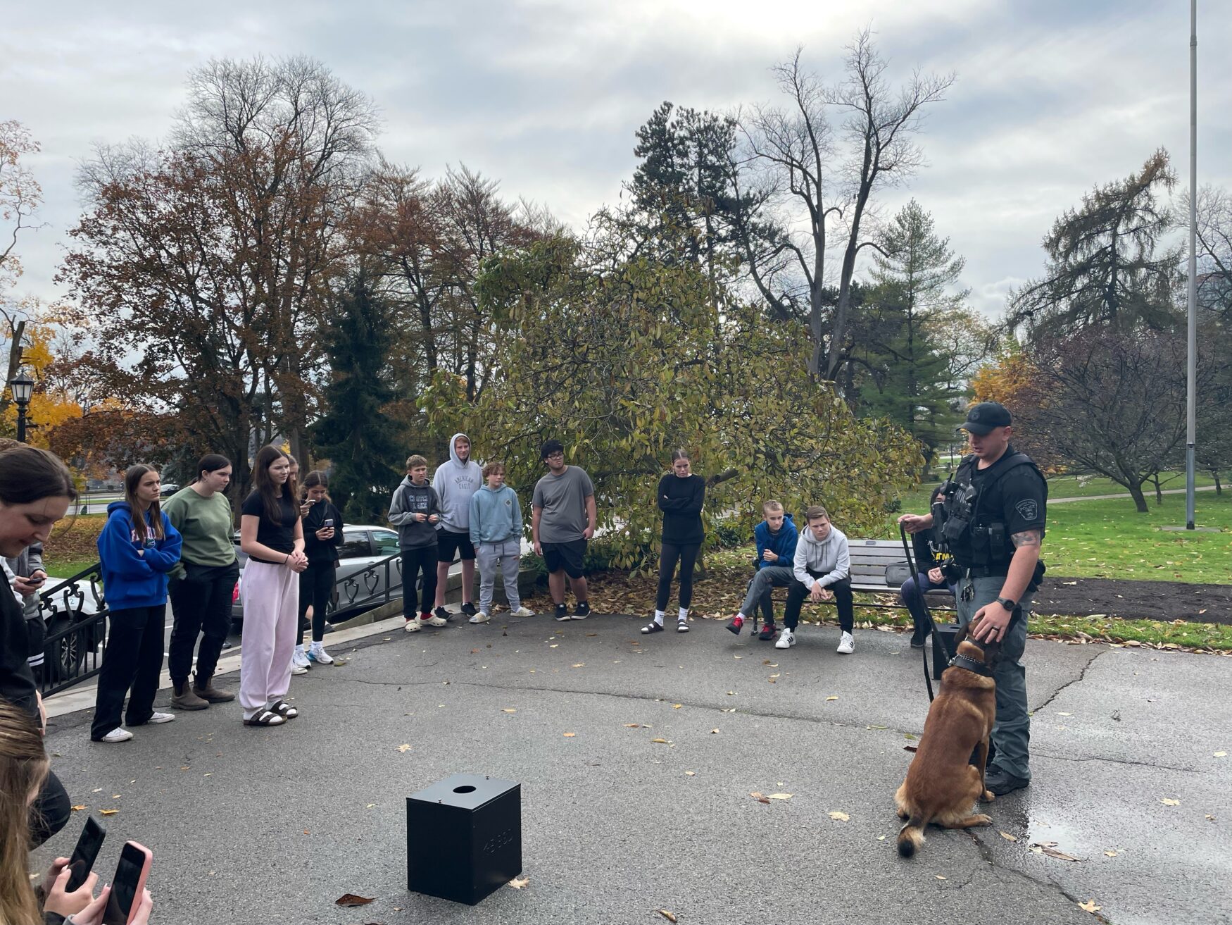 An officer with his k9 unit Aero teaching children